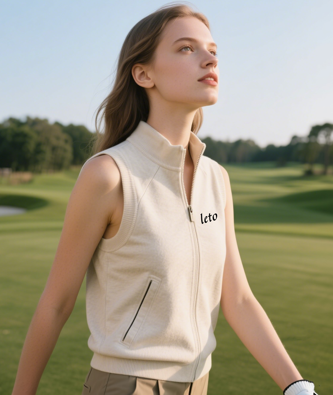 A golfer wearing an eco-friendly polo made from recycled materials, surrounded by a lush green golf course, embodying sustainability and style