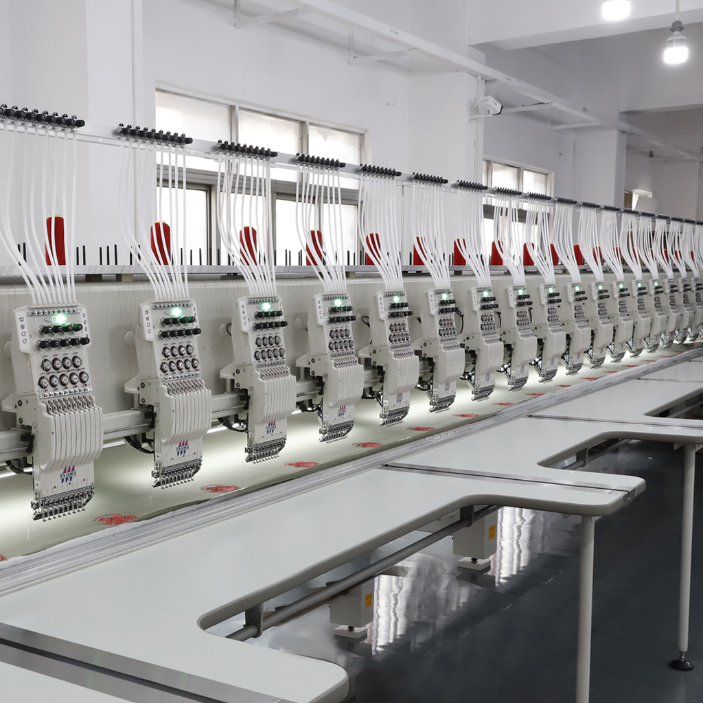 A close-up of advanced embroidery equipment stitching a detailed logo on a polo shirt, showcasing precision and high-quality craftsmanship