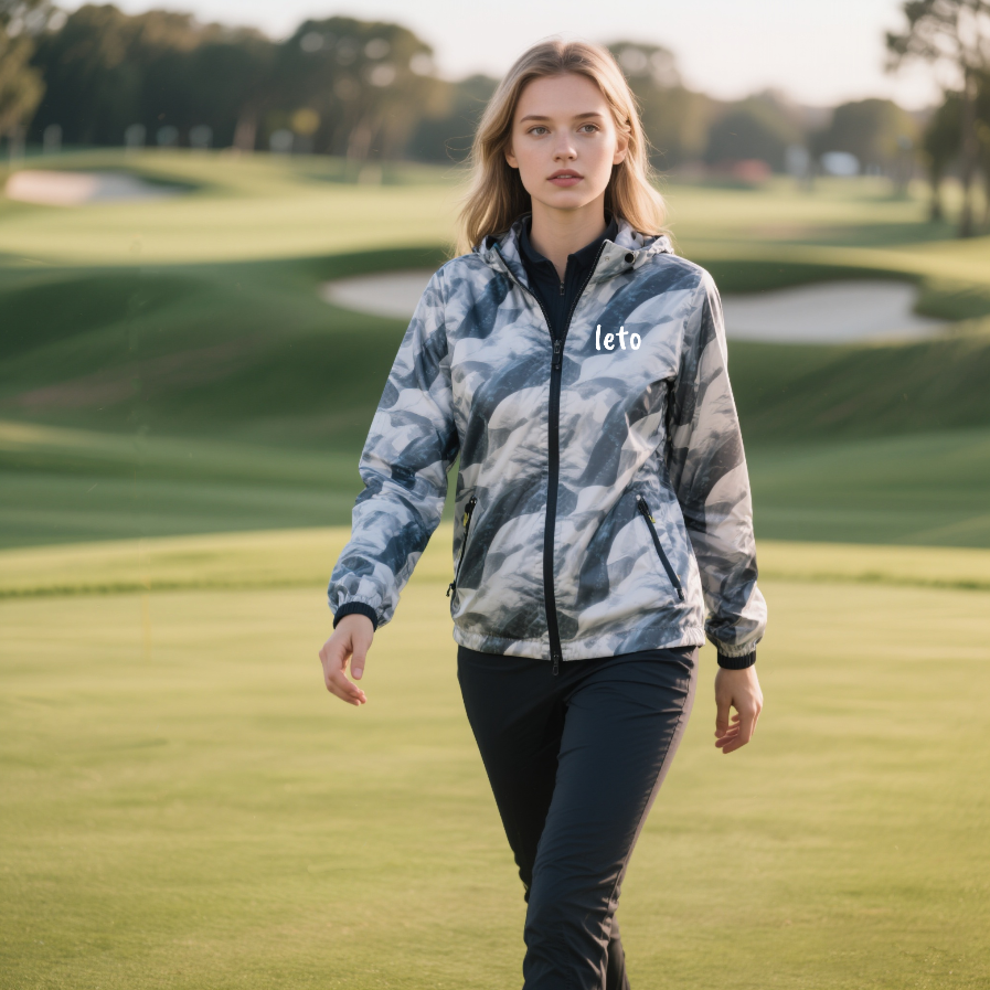 A startup founder reviewing custom golf apparel designs with a team, preparing to launch a new golf clothing brand.